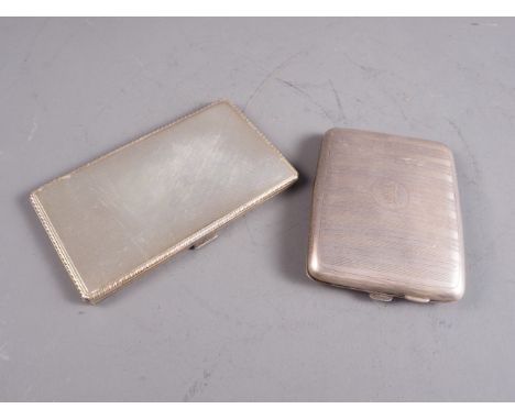 Two engine turned silver cigarette cases, 10oz troy approx