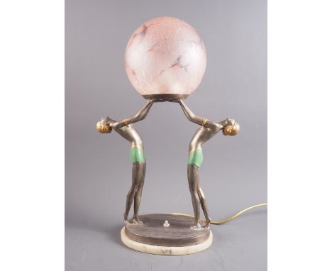 An Art Deco style painted metal table lamp, formed as two figures, on oval marble base, with art glass shade, 19 1/2" high ov