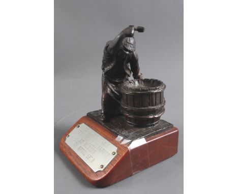 A bronze model of the "Burton Cooper", 3 3/4" high, on stand