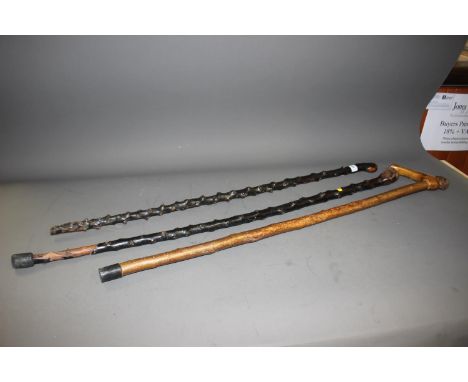 Two blackthorn walking sticks, a hazel stick with burr elm handle, and twenty-seven others, a Chinese metal embossed and bamb