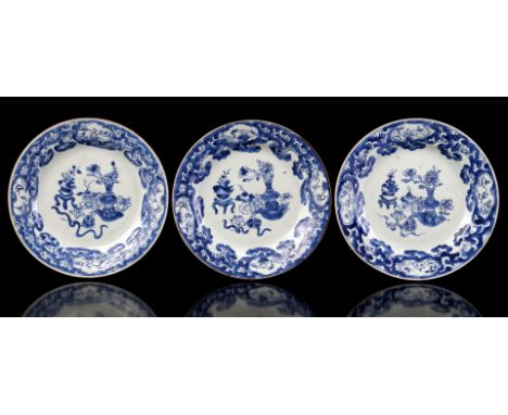 3 porcelain dishes decorated with flower vases together with an incense burner and various flowers such as lotus, chrysanthem
