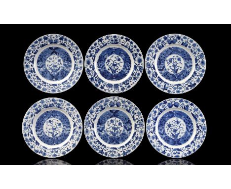 6 porcelain dishes with a floral decoration of chrysanthemums, lotuses and peonies built up in rings and on the bottom an art