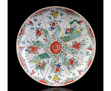 Porcelain polychom colored dish with chrysanthemum in the center surrounded by various floral decorations divided into cartou