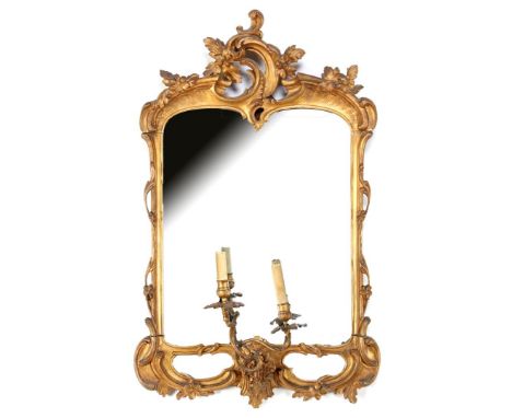Faceted mirror in gold-coloured frame with rocaille crest and various floral accents, among others. detachable iron 2-light c