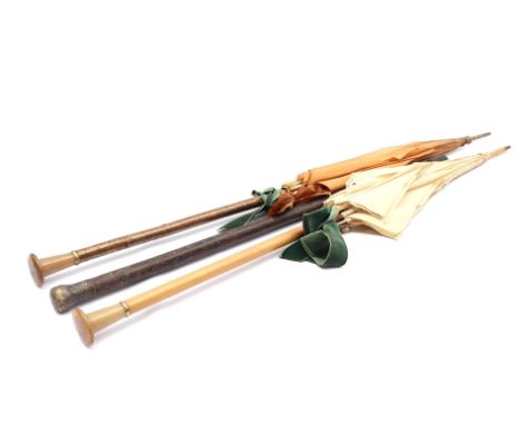 2 antique umbrellas with wood and horn, weathered fabric 113 cm and 114 cm long and wooden walking stick with metal knob 90 c