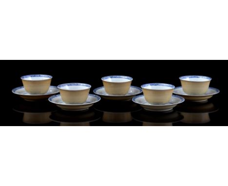 5 porcelain cups and saucers with Cafe-au-lait on the outside and floral decor on the inside with conch shell mark representi
