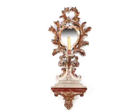 18th century wooden richly decorated and polychrome colored wall mirror with candlestick 125 cm high, 53 cm wide. Provenance 