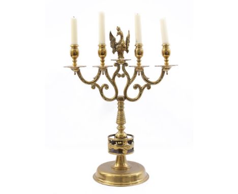 Brass 4-light table candlestick with eagle on top 58 cm high, 43 cm wide. Provenance collection Castle Frymerson in Sint Odil