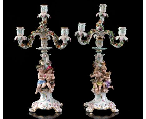 2 Meissen porcelain 5-light 2-piece table candlesticks richly decorated with putti and flowers 51 cm high (a few light leaf d