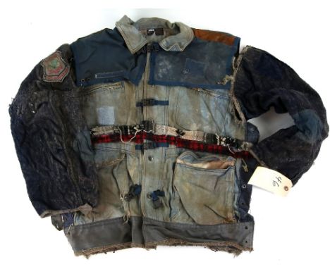 The Postman (1997) - Decrepit jacket from the Warner Bros film. Label attached inscribed PSM-C200.Provenance: With Backlot Pr