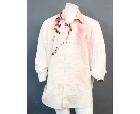Poseidon (2006) - Costume comprising a blood stained shirt and a pair of torn black trousers from the film starring Kurt Russ