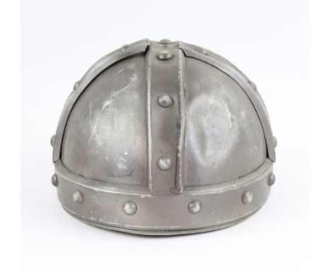 Five tin helmets used in The Adventures of Robin Hood (1938) and The Black Arrow (1948), largest 24cm high.