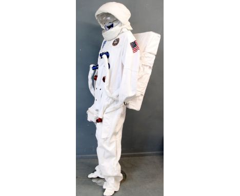 Unknown production NASA astronaut consume comprising a full-length space suite, helmet, boots and back-pack. The suit and hel