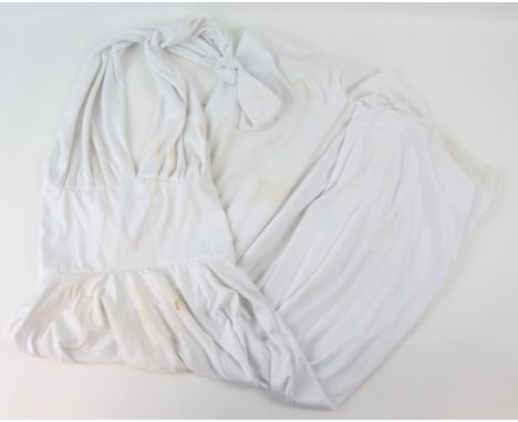 A white dress worn by Anna Nicole Smith during a 1993 Playmate of the Year announcement party.Provenance: With Unique Props c