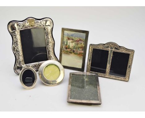 An engine turned silver mounted photograph frame, Birmingham 1927, of rectangular form with arched top, 15cm x 10cm, together
