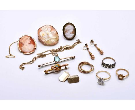 A small collection of jewellery, comprising; two oval shell cameo brooches each mounted in yellow metal, an orange tourmaline