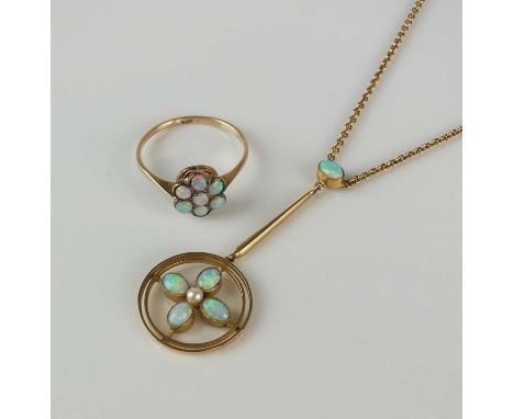 An early 20th century style opal pendant on chain, designed as a stylised opal and split seed pearl floral cluster mounted wi