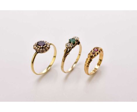 A 9ct gold three stone emerald and diamond ring, size Q, together with a garnet and split seed pearl cluster ring, size Q 1/2