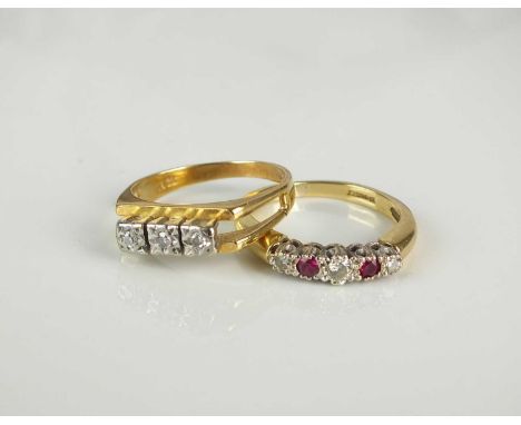 An 18ct gold five stone graduated diamond and untested ruby ring, size O, together with a three stone diamond ring, stamped '