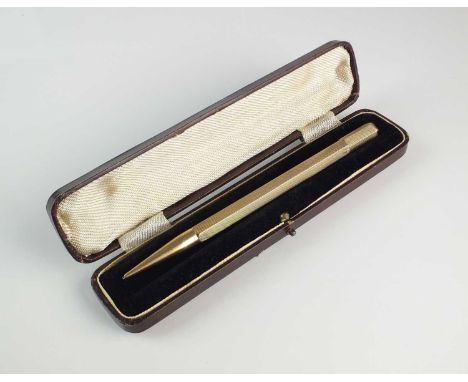 A yellow metal propelling pencil, of hexagonal engine turned form, engraved 'A.R.B.P', stamped '9c', 13cm long, weight approx