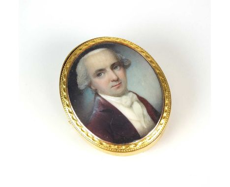 An early 19th century ivory miniature brooch / pendant, the portrait miniature depicting a gentleman wearing a cream waistcoa