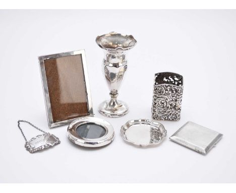 An Edwardian silver sauce bottle mount, Birmingham 1903, together with a silver Sherry decanter label, two silver mounted fra