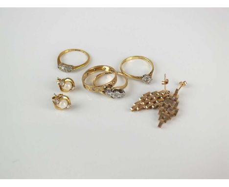 A small collection of jewellery, comprising; two yellow metal diamong rings stamped '18ct', total weight approx 4.2g, an 18ct