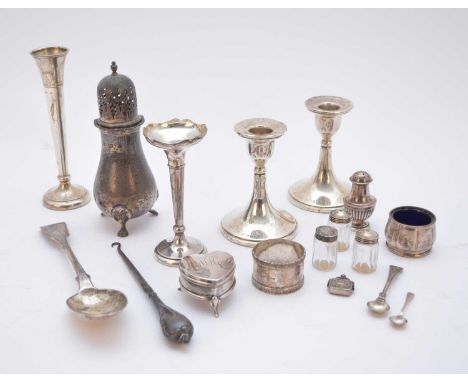 A small collection of silver, comprising; a baluster silver sugar caster, Birmingham 1975, a pair of short silver mounted can