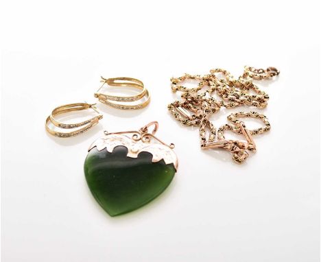 A heart shaped jade pendant, the decorative yellow metal mount stamped '9', together with a yellow metal chain with plated cl