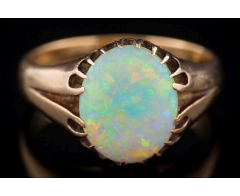 A gentleman's 18ct gold and opal single-stone ring: the oval opal approximately 12.7mm long x 10.3mm wide x 2.7mm deep, Birmi