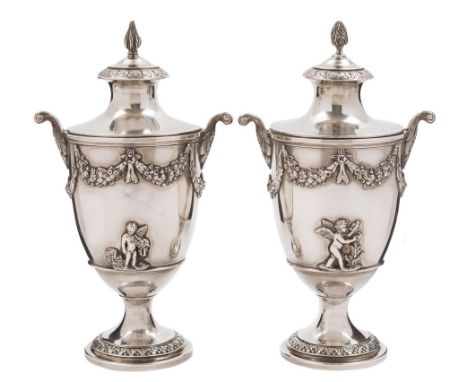 A pair of Edward VII  silver urns and covers, maker C S Harris & Sons Ltd, London 1908: the covers with flame finial and acan