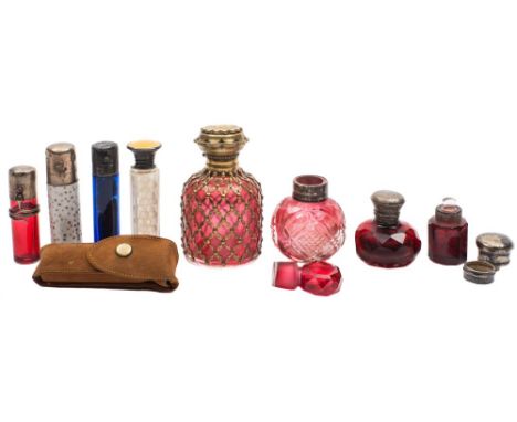 Six coloured glass scent bottles and two others: various colours, some with cut decoration, silver and e.p. mounts together w