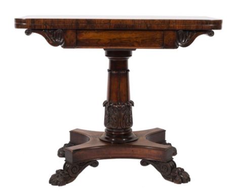 A William IV carved rosewood rectangular card table:, the baize lined hinged top with rounded corners, on volute and acanthus