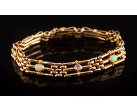 An opal and diamond mounted three-bar gate-link bracelet: set with four circular old-cut diamonds each approximately 0.20ct a