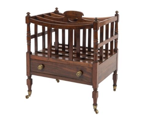 A Regency rosewood four-division Canterbury,: with curved and slatted divisions, central carrying handle and ring turned upri