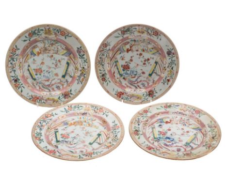 A set of four Chinese famille rose plates: each painted with a scroll shaped panel, a phoenix, auspicious objects, flowers an