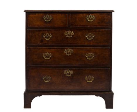 An 18th Century oak and mahogany crossbanded rectangular chest:, the top with a moulded edge, containing two short and three 
