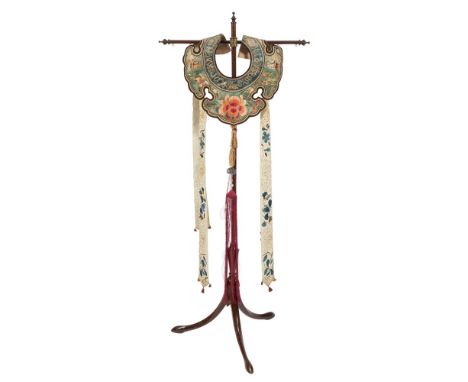 A Chinese silk embroidered collar,: the shaped green ground surround embroidered with insects, birds and central peony blosso