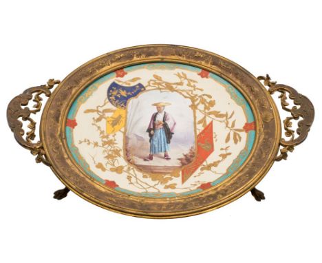 A French 'Japonesque' ormolu-mounted pottery tripod dish: painted with a central panel depicting a man wearing a conical stra