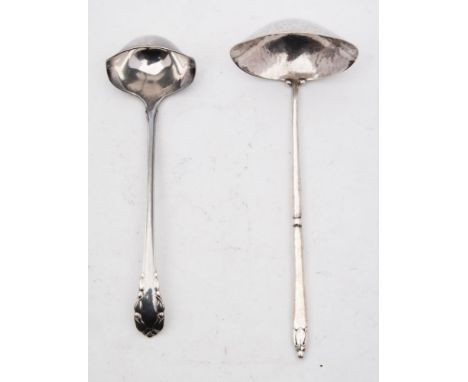 A Georg Jensen silver sauce ladle, maker C F Heisse, stamped marks: together with another Georg Jensen silver sauce ladle, to