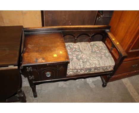 AN OAK TELEPHONE TABLE 