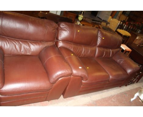 A BROWN LEATHER SOFA TOGETHER WITH A MATCHING CHAIR 