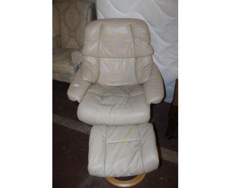 A STRESSLESS STYLE RECLINING ARMCHAIR WITH MATCHING STOOL 