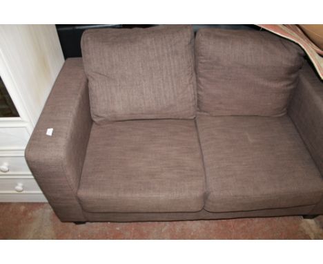 A MODERN TWO SEATER UPHOLSTERED SOFA  