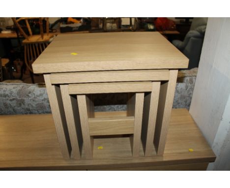 A MODERN LIGHT OAK NEST OF TABLES 