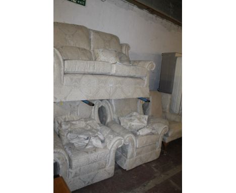 A FOUR PIECE UPHOLSTERED SUITE CONSISTING OF A TWO SEATER SOFA AND THREE CHAIRS 