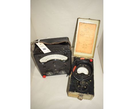 A universal avometer model 40; and a decibel meter in a metal case.