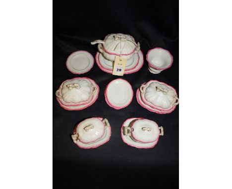 A German ink bordered ceramic doll's miniature dinner service, comprising: pair of tureens, covers and stands; pair of entree