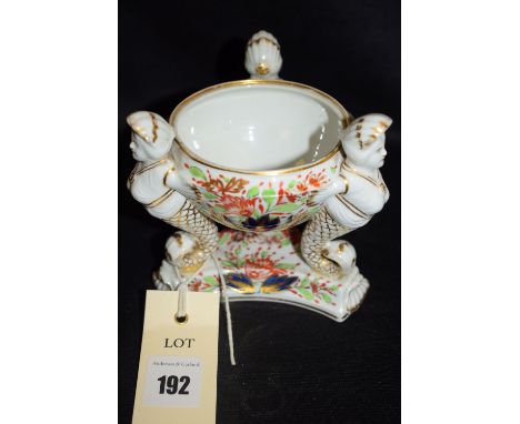 A small Derby style 19th Century circular ceramic bowl with caryatid support and triform base, decoration in Imari colours, n