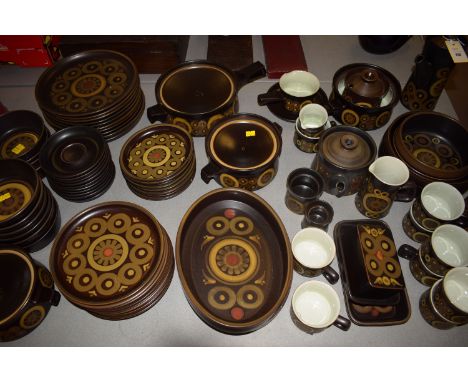 A large quantity of Denby Arabesque oven to table ware approximately ten place settings: with coffee cups and saucers, dinner